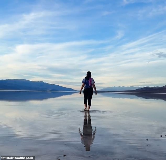 Videos show that visitors can walk a few inches through the lake and touch the basin