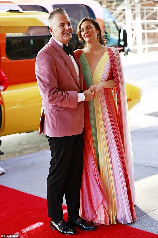 The dress had a deep design with a v-neck and shades of pink, peach, sorbet, yellow and turquoise