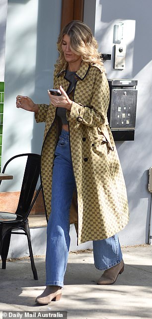 She paired her look with skin-tight jeans and Isabel Marant heels