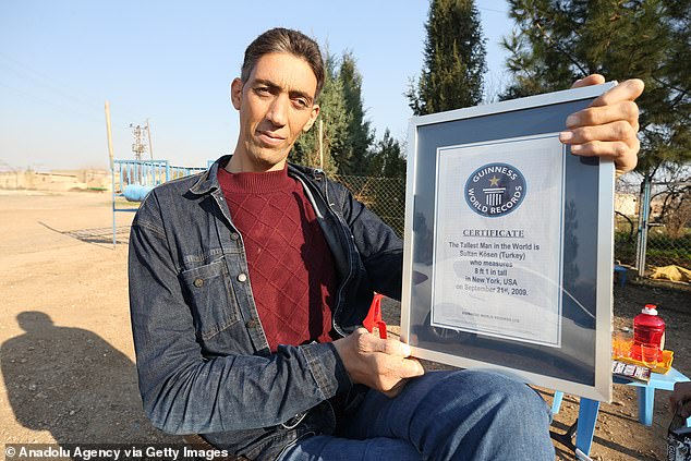 According to the Guinness World Records, Kosen is the first person in more than a decade to measure over 2.5 meters and is one of only 10 confirmed cases in history.  He earned the record title in 2009 (photo above)