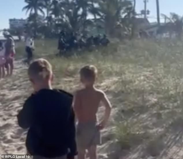 Moments later, a group of adults were seen rushing one of the two children from the beach for medical attention, while other young people watched the horror unfold.