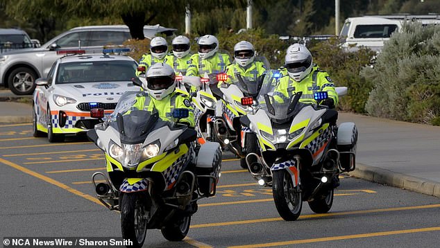 Hundreds of Western Australian police officers attended Constable Woods' funeral at Optus Stadium in Perth last July (pictured)