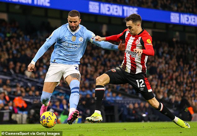 Brentford's Sergio Reguilon in action against Manchester City's Kyle Walker on Tuesday evening