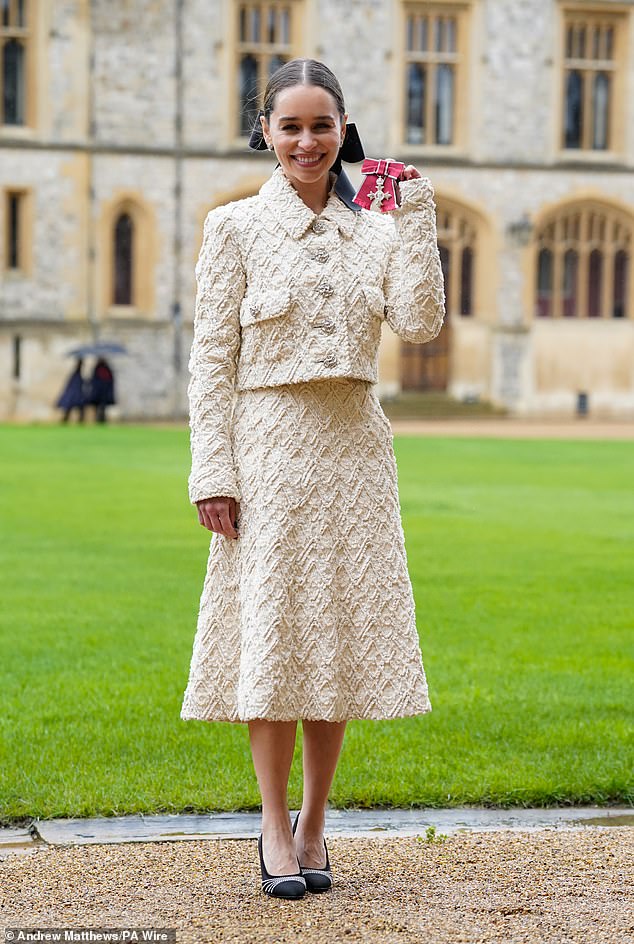 The Game Of Thrones star, 37, beamed from ear to ear as she accepted her award at Windsor Castle on Wednesday