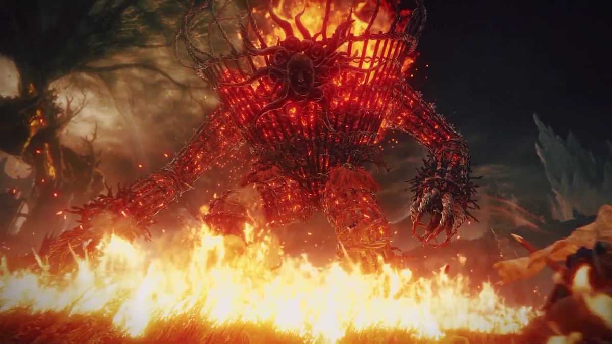 An image of a giant flaming monster in the trailer for Elden Ring: Shadow of the Erdtree.  It almost looks like a huge humanoid bundle of sticks that is one fire and walking around.  It also has a mask for a face. 