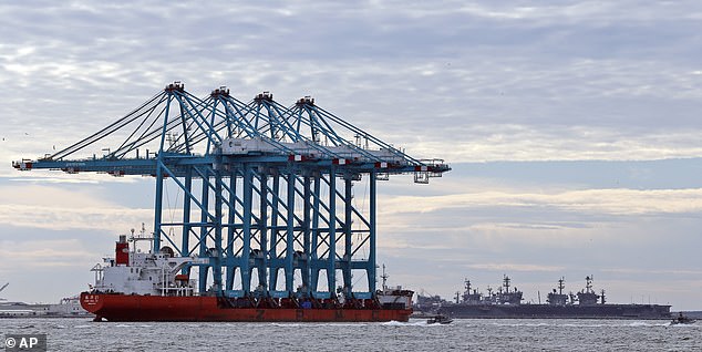 A Chinese ship with giant cranes approaches Norfolk Naval Station in Hampton, Virginia.