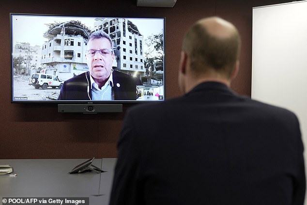 William listens as Pascal Hundt, Senior Crisis Manager, International Committee of the Red Cross, dials in on a video call from Gaza