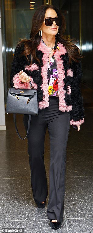 For her TV stint, she wore a fur jacket and a colorful blouse