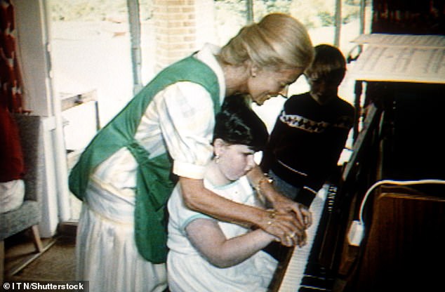 The Duchess has long been a supporter of providing access to music education to young talent across Britain.  She is pictured visiting Helen House Hospice in 1985