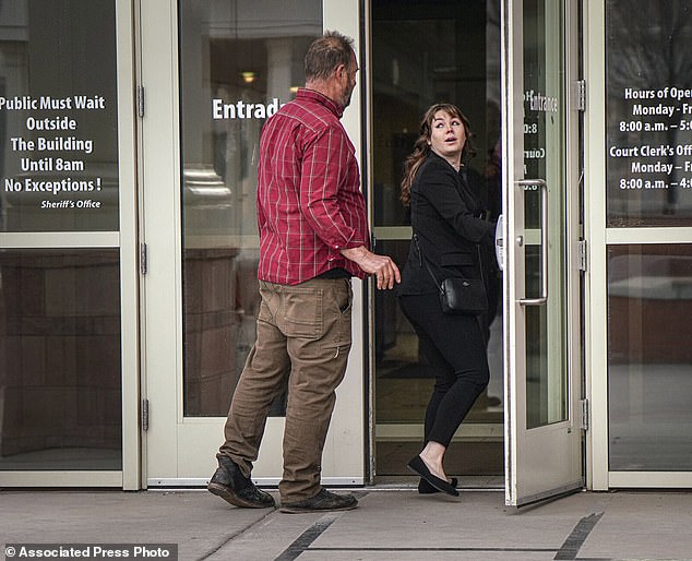 Gutierrez-Reed, right, arrives at the First Judicial District Courthouse in Santa Fe, NM, on Wednesday, February 21, 2024, for the start of her trial on charges of involuntary manslaughter and tampering with evidence