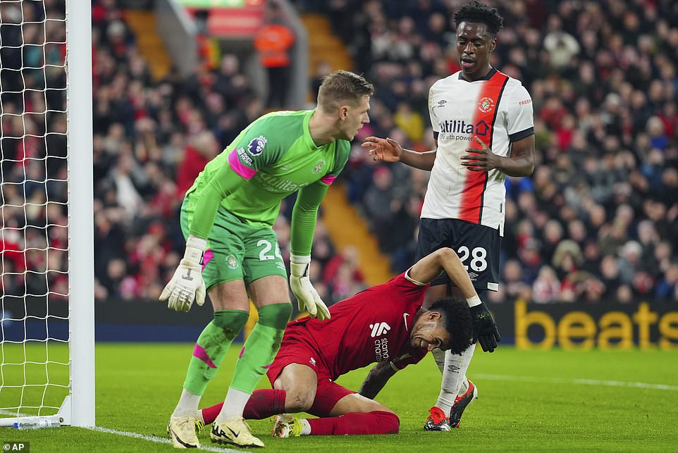 Diaz furiously slams his hand on the turf after squandering a glorious chance to level the game for the hosts