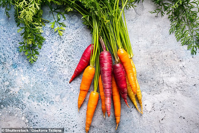 The pigment beta-carotene is responsible for turning carrots orange.  And eating too many carrots can do the same to your urine