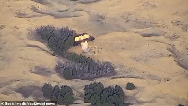 This time the flash of a rocket is seen in a split second before another explosion erupts from the ground.  The soldiers drop to the floor as if struck by lightning