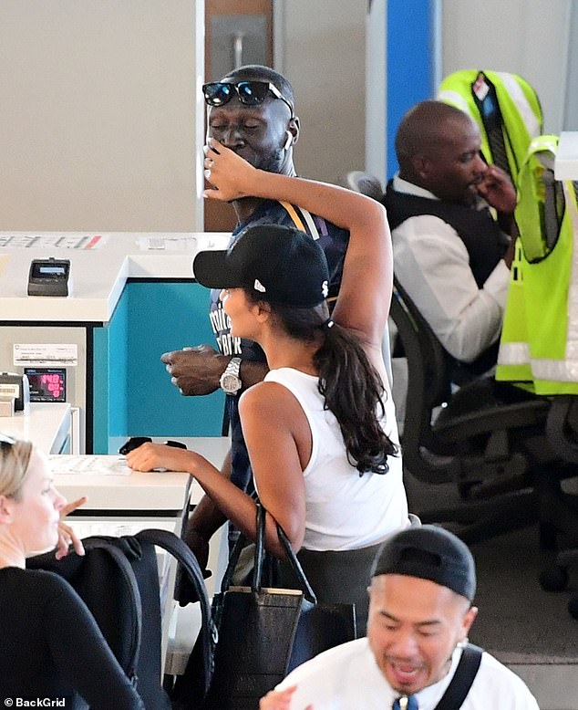 They looked playful as they checked in for their flight