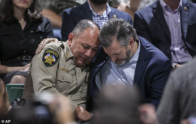 Uvalde County Sheriff Ruben Nolasco, left, is comforted by Ted Cruz.  Nolasco was singled out for his catastrophic lack of leadership during the mass shooting