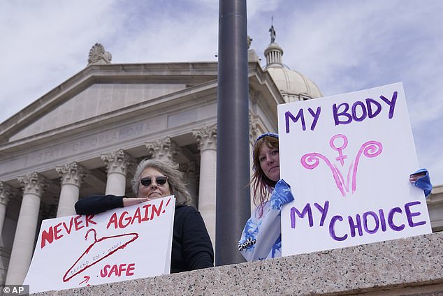 Above are campaigners outside the Oklahoma state legislature.  They are urging state lawmakers not to ban abortions