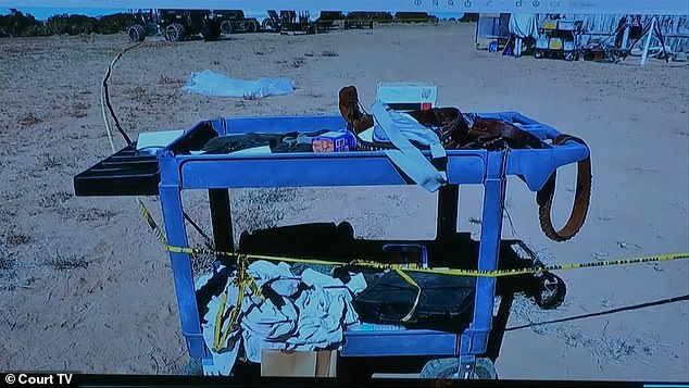 The jury was then shown a photo taken by Marissa Poppell, a crime scene technician with the Santa Fe County Sheriff's Office, of the prop truck looking very disorganized and littered with fake bullets next to a live round.