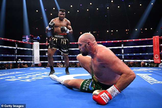 The Cameroonian's last fight saw him shock the combat sports world by knocking down Tyson Fury (pictured) en route to a controversial split-decision loss to the champion boxer