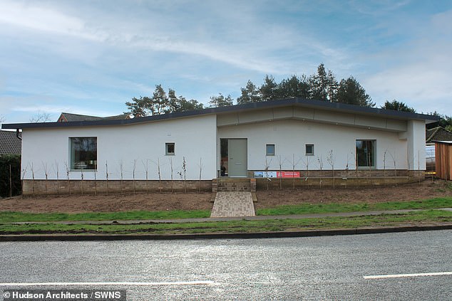 The property has large triple glazed windows facing south for solar energy in winter and an air source heat pump provides heating.  Pictured: The front of the completed house in Norfolk