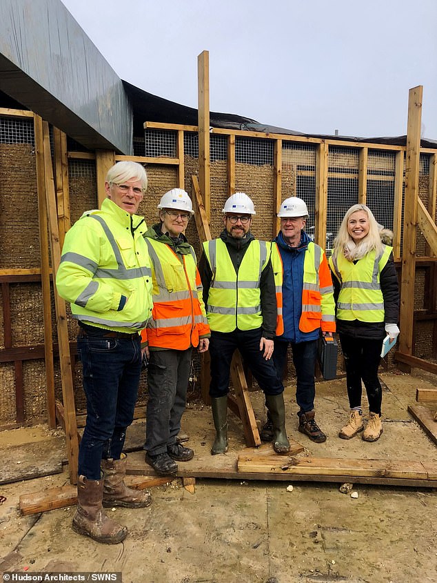 The walls in the CobBauge house in Fakenham, Norfolk, are made of hemp straw, water and earth (or mud), known as Cob.  Pictured: Anthony Hudson on the far left