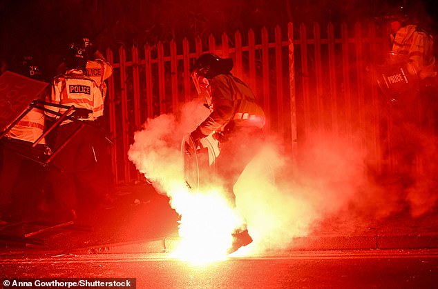 One officer was set on fire by a flare and five officers were injured before the Euro-tie