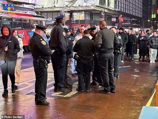 Officers cordoned off the tourist destination as a crowd of onlookers gathered