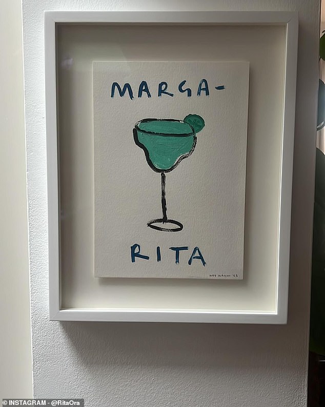 Rita's last photo showed a painting of blue margarita.  Above the drink was 'Marga-' and below it 'Rita', drawing attention to the singer's name