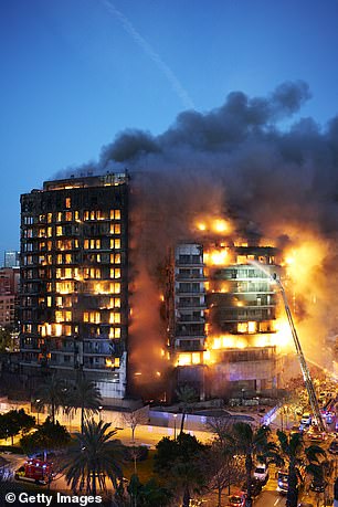 Firefighters are working at the location during the building fire on February 22, 2024