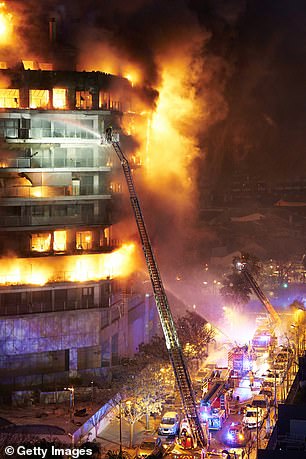 Firefighters are working at the location during the building fire on February 22, 2024