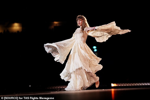 The crowd was also impressed by her flowing white dress, which caught the light as she twirled, her arms in the air