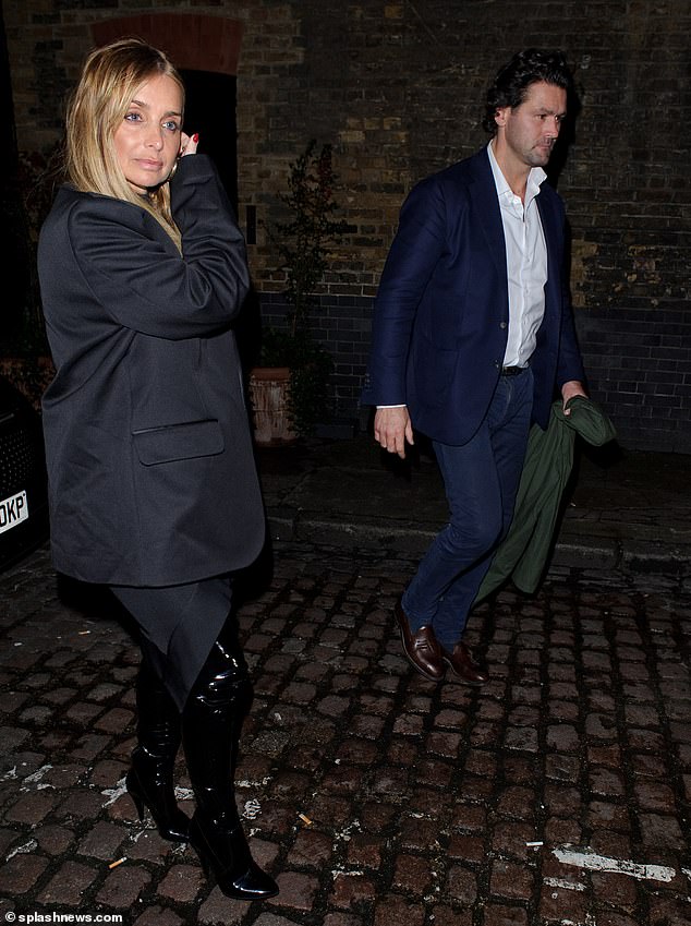 The singer (pictured with Drew) looked sensational in a black lace bra and black sheer top, which she teamed with a black blazer and sporty satin lapels