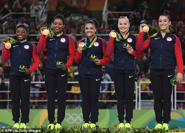 Douglas (second from left) won team gold again with the United States in Rio in 2016