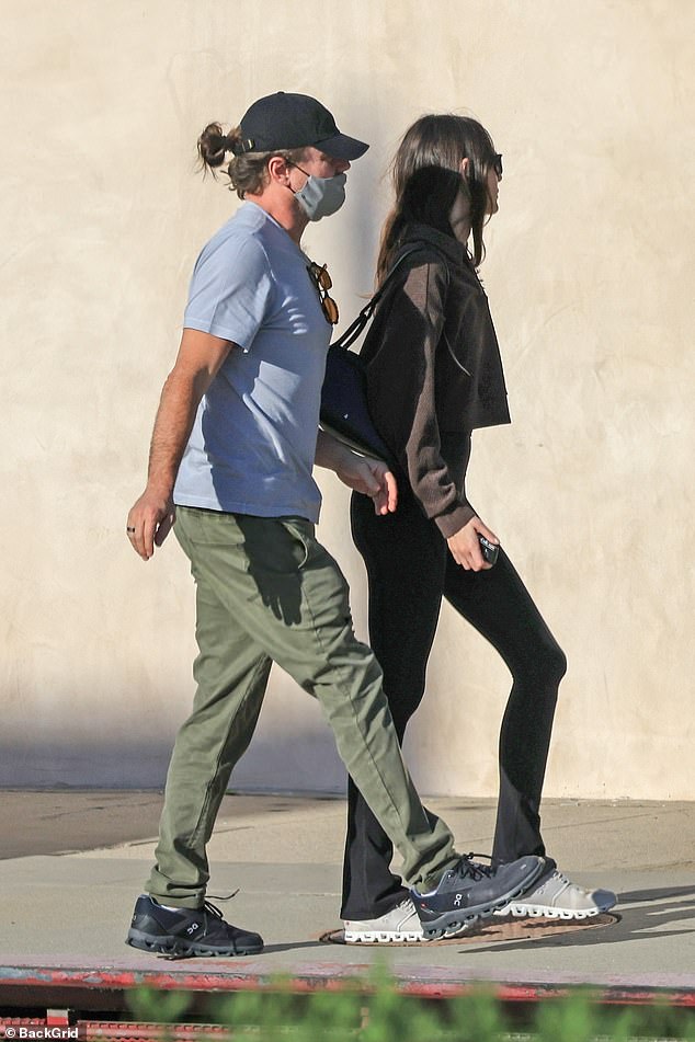 The pair were dressed casually with the Wolf of Wall Street actor in a light blue t-shirt, green skinny pants, black sneakers and a black cap.