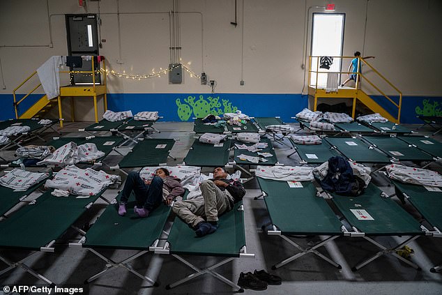 Migrant children from several Latin American countries rest on cots in one of Annunciation House's many shelters in El Paso, Texas