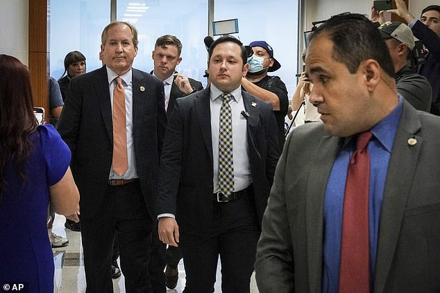 Texas Attorney General Ken Paxton, pictured Feb. 16 as he leaves a hearing in Houston for a security fraud crime in which he is a suspect