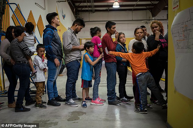 Migrant children from several Latin American countries wait for food at a new center opened by the Annunciation House to help the surge of migrants being released by U.S. Border Patrol and Immigration and Customs Enforcement in El Paso, Texas, on April 24, 2019