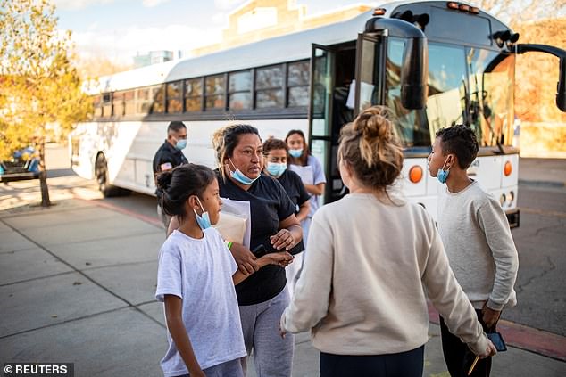 Asylum-seeking migrants are dropped off at Annunciation House in El Paso in December 2022 after being screened by U.S. Customs and Border Protection