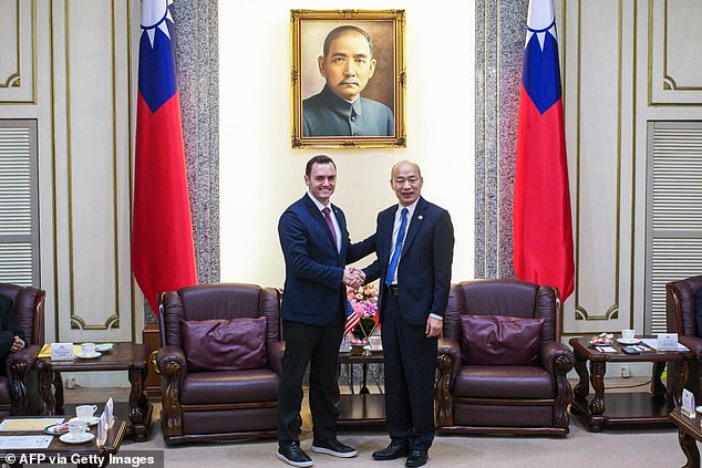 Mike Gallagher shakes hands with Taiwanese Parliament Speaker Han Kuo-yu