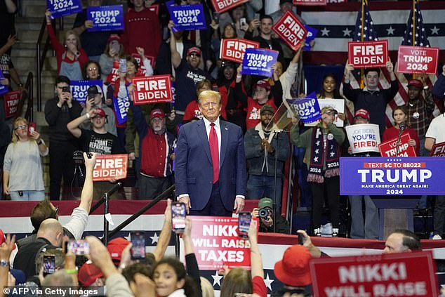 Former President Donald Trump arrives for his South Carolina primary rally in Rock Hill, South Carolina.  The Republican front-runner praised MAGA-nomics in the hour-and-a-half speech and also said the stock market would crash if he lost to President Joe Biden.