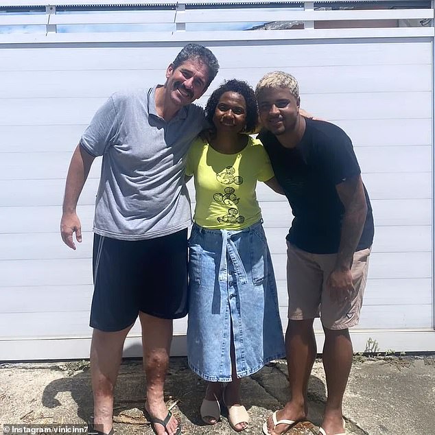 Marcos de Souza (right) was reunited with Jorge Mendes and Berlandia Mendes on Thursday, a day after he rescued her and her twin daughters from flooding in Rio de Janeiro after she and her children were trapped in the family car