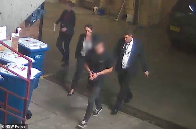 Beau Lamarre-Condon was charged after turning himself in to police in Bondi following a massive manhunt (pictured, Lamarre-Condon is led away for questioning by detectives)