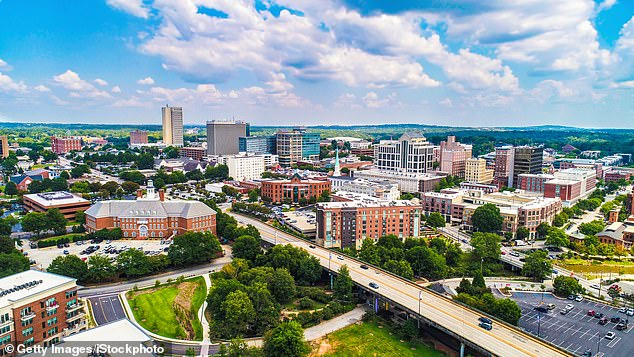 Many people have moved from the blue states to the southern red states, attracted by lower taxes, warmer weather and a lower cost of living.  The photo shows the skyline of Greenville, South Carolina