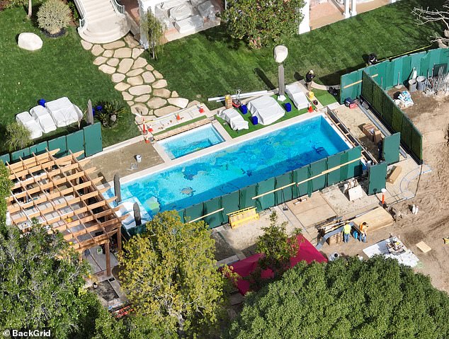 Aerial photographs also show the development of elaborately designed tropical-themed swimming pools