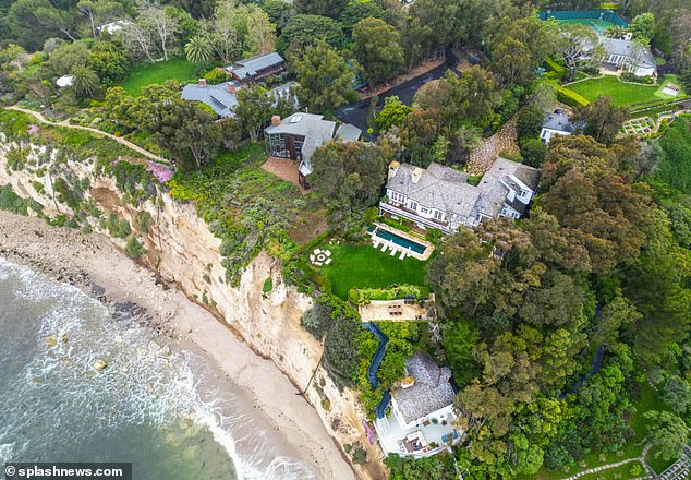 The couple can spend some time at their Knispel's expansive oceanfront estate, pictured, until they can move to the Beverly Hills estate