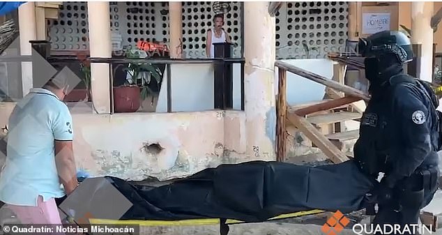 Police in Acapulco on Thursday remove one of two bodies found dead in a cabana on Condesa Beach in Acapulco, Mexico.  The city reported 31 homicides