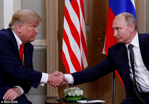 Then-President Donald Trump and his Russian counterpart Vladimir Putin shake hands in Helsinki, Finland, in 2018