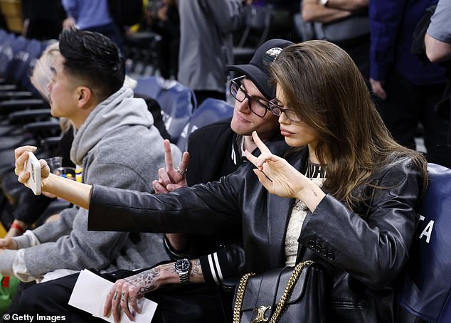 During halftime, the brother-sister duo were also spotted taking a series of funny selfies as they posed and drew a peace sign as they waited for the big game to go ahead.