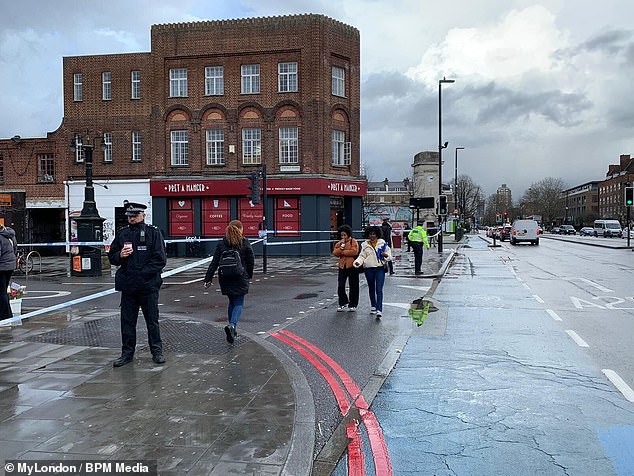 After the brawl took place, a large police cordon (photo) was set up with officers standing nearby