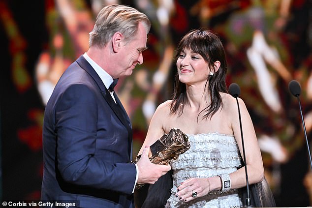 Christopher looked incredibly dapper as he wore a navy blue tuxedo as he graciously accepted the award