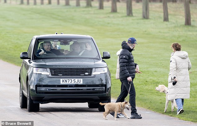 Later, the prince was in a much happier mood as he drove through Windsor, this time accompanied by a friend